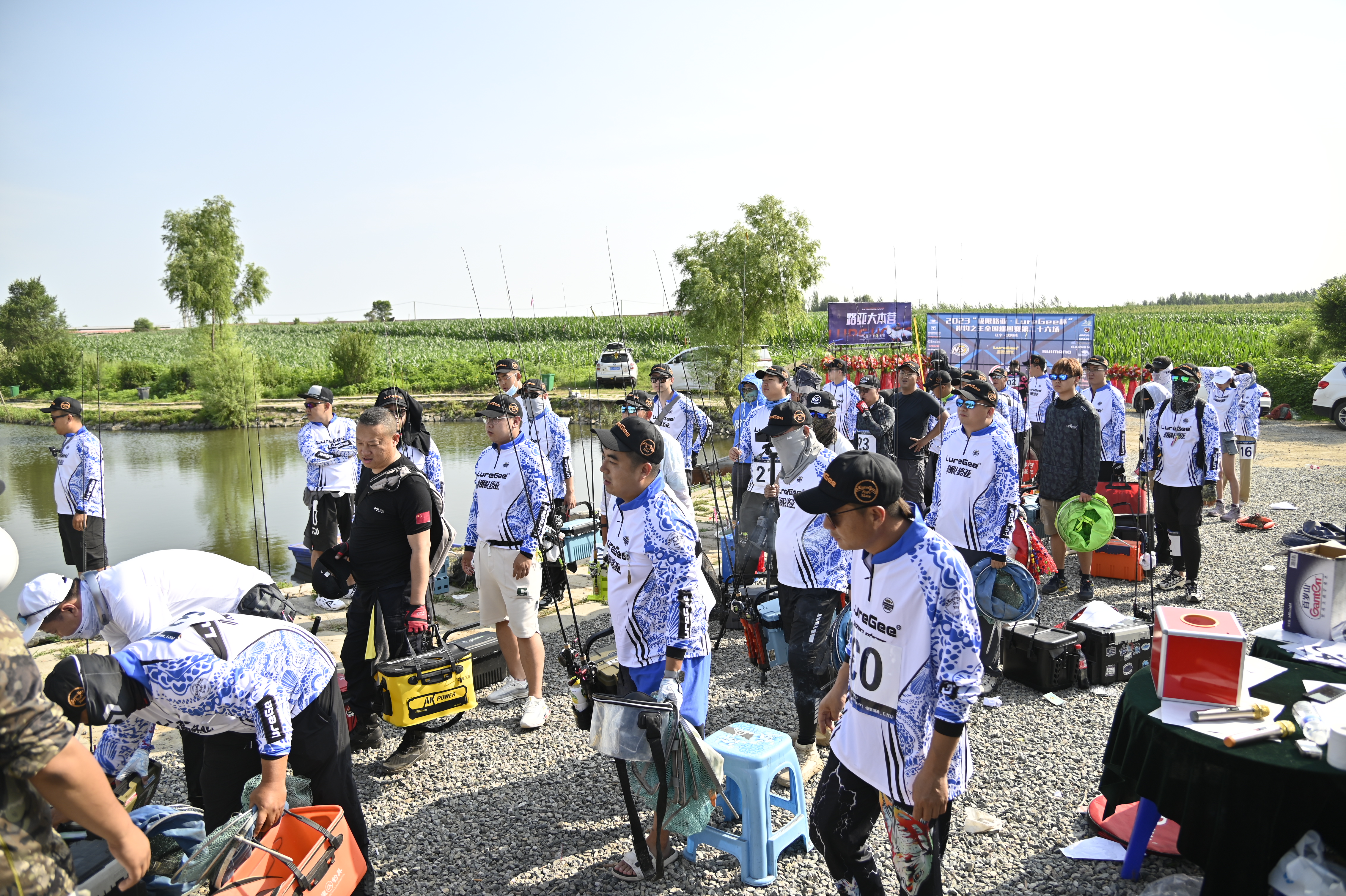 Competitors preparing tackle beside the tournament lake