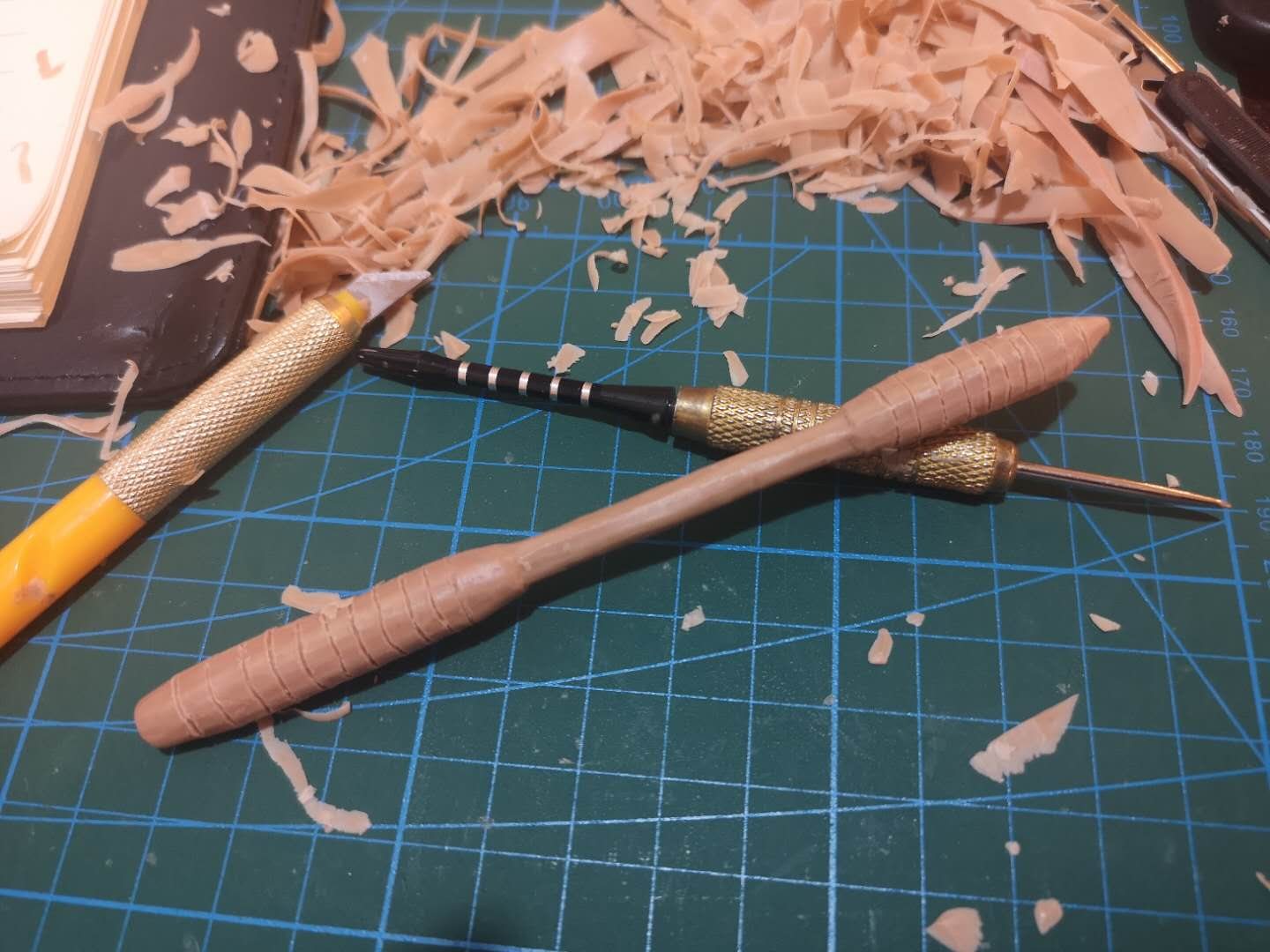 Fishing lure prototype being shaped on a development workbench
