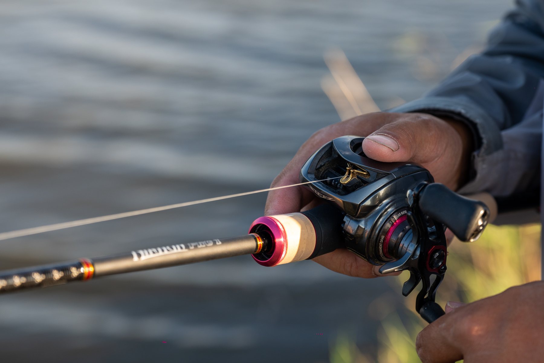 Angler operating a baitcasting reel during field use