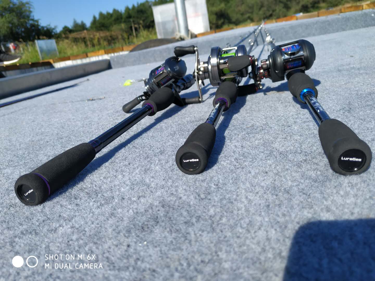 Fishing reels and rods displayed together for a range review